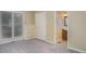 Bedroom featuring a window with blinds, a built-in bookshelf, neutral colored carpet, and an ensuite bathroom entrance at 140 Rustic Way Ln, Mooresville, NC 28117