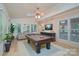 Relaxing game room with a pool table, comfortable couch, and stylish decor at 140 Rustic Way Ln, Mooresville, NC 28117