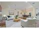 Bright living room with a cozy sitting area, dining area, and modern decor at 140 Rustic Way Ln, Mooresville, NC 28117