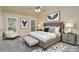 Staged bedroom with seating and winged wall decor at 140 Rustic Way Ln, Mooresville, NC 28117