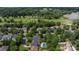 An aerial view features a pool, well-manicured lawns, and proximity to a golf course, enhancing the community's appeal at 14103 Hiawatha Ct, Huntersville, NC 28078