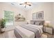 A cozy bedroom bathed in natural light showcases stylish decor and a comfortable bed, creating a peaceful retreat at 14103 Hiawatha Ct, Huntersville, NC 28078