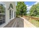 A spacious outdoor deck provides the perfect spot for relaxation and entertaining with its charming wooden railing at 14103 Hiawatha Ct, Huntersville, NC 28078