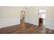 Open-concept space with hardwood floors seamlessly connecting the dining area to other living spaces at 14103 Hiawatha Ct, Huntersville, NC 28078