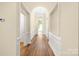 Inviting foyer with hardwood floors, an arched window, and neutral paint at 14103 Hiawatha Ct, Huntersville, NC 28078