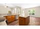 Bright kitchen with wood cabinets, stainless steel appliances, granite countertops, and wood-look flooring at 14103 Hiawatha Ct, Huntersville, NC 28078
