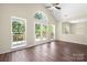 A spacious living room with hardwood floors, vaulted ceilings, and access to a deck at 14103 Hiawatha Ct, Huntersville, NC 28078