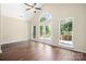 Large living room with hardwood floors, vaulted ceilings, and a private deck at 14103 Hiawatha Ct, Huntersville, NC 28078