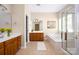 Bright main bathroom featuring double sinks, a soaking tub, and a glass-enclosed shower at 14103 Hiawatha Ct, Huntersville, NC 28078
