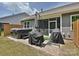 Backyard patio with a hot tub, grill, and screened-in porch, perfect for outdoor living at 15614 Aviary Orchard Way, Charlotte, NC 28278