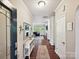 Welcoming entryway with hardwood floors leading to a comfortable living room with a fireplace at 15614 Aviary Orchard Way, Charlotte, NC 28278