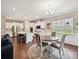 Bright eat-in kitchen with white cabinetry, stainless appliances, and a large island with seating at 15614 Aviary Orchard Way, Charlotte, NC 28278