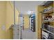 Unfinished basement with storage shelves, utility area, and yellow walls at 15724 Eagleview Dr, Charlotte, NC 28278