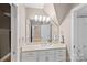 Bright bathroom with a single sink vanity, ample storage space, and neutral color palette at 15724 Eagleview Dr, Charlotte, NC 28278