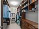 Spacious walk-in closet with custom shelving, drawers, and ample storage space for clothing and accessories at 15724 Eagleview Dr, Charlotte, NC 28278
