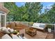 Relaxing outdoor deck with comfortable seating and lush greenery, perfect for entertaining guests at 15724 Eagleview Dr, Charlotte, NC 28278