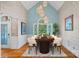 Elegant dining room with a high ceiling, stylish lighting, and ample seating for formal occasions at 15724 Eagleview Dr, Charlotte, NC 28278