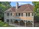 Two-story home with large deck, backyard, and outdoor entertainment area at 15724 Eagleview Dr, Charlotte, NC 28278