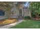 Charming home with stone steps, black railing and lush landscaping at 15724 Eagleview Dr, Charlotte, NC 28278