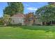 Charming one-story home with a manicured lawn, mature trees, and a welcoming entrance at 15724 Eagleview Dr, Charlotte, NC 28278
