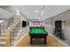 Basement game room with billiard table, bar, and entertainment area, perfect for leisure at 15724 Eagleview Dr, Charlotte, NC 28278