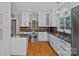 Bright kitchen with granite countertops, stainless steel appliances, and custom cabinetry at 15724 Eagleview Dr, Charlotte, NC 28278