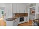 Kitchen features white cabinets, granite countertops, and stainless steel appliances at 15724 Eagleview Dr, Charlotte, NC 28278