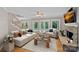 Bright living room boasts a fireplace, backyard access, and comfortable seating, perfect for relaxation at 15724 Eagleview Dr, Charlotte, NC 28278