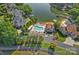 Aerial view of a pool, private beach, boat slips, and luxury homes on Lake Norman at 15724 Eagleview Dr, Charlotte, NC 28278