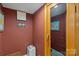 Interior view of a home sauna with seating, wooden walls, and a glass door for relaxation at 15724 Eagleview Dr, Charlotte, NC 28278