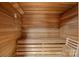 Wooden sauna features built-in benches, providing a tranquil and relaxing experience at 15724 Eagleview Dr, Charlotte, NC 28278