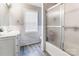 Bright bathroom with a shower, vanity, and marble tiled walls at 2040 Brantley Creek Dr, Kannapolis, NC 28083