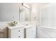 Bright bathroom with a vanity, marble tiled walls, and decorative fixtures at 2040 Brantley Creek Dr, Kannapolis, NC 28083