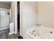 Bright bathroom features a soaking tub and a glass-enclosed shower for a spa-like experience at 2040 Brantley Creek Dr, Kannapolis, NC 28083