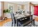 Stylishly furnished dining area featuring hardwood floors, a modern table setting, and ample natural light at 2040 Brantley Creek Dr, Kannapolis, NC 28083