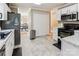 Spacious kitchen with white cabinets, stainless steel appliances, and modern flooring at 2040 Brantley Creek Dr, Kannapolis, NC 28083