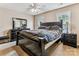 Well-lit primary bedroom with a ceiling fan, windows, and plenty of closet space at 2040 Brantley Creek Dr, Kannapolis, NC 28083