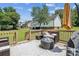 Spacious outdoor deck with seating and an umbrella overlooking a lush backyard at 2040 Brantley Creek Dr, Kannapolis, NC 28083