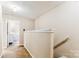 Upstairs hallway featuring carpet, light-colored walls, and white trim at 2040 Brantley Creek Dr, Kannapolis, NC 28083