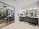 A luxurious en-suite bathroom connects to the bedroom with a dual vanity and modern decor at 217 Turtleback Rdg, Weddington, NC 28104