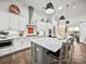 Well-appointed kitchen with stainless steel appliances, a center island, and plenty of counter space at 217 Turtleback Rdg, Weddington, NC 28104