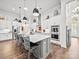 Bright open kitchen with stainless steel appliances, a center island, and ample cabinet space at 217 Turtleback Rdg, Weddington, NC 28104