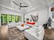 Spacious living room with coffered ceilings, modern decor, and large windows offering ample natural light at 217 Turtleback Rdg, Weddington, NC 28104