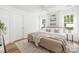 Serene bedroom with plush bedding, neutral tones, and bright natural light at 3100 Hickory Grove Dr, Monroe, NC 28110