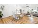 Open concept dining area with modern table and chairs, flowing into the living space at 3100 Hickory Grove Dr, Monroe, NC 28110