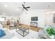 Open-concept living room with vaulted ceilings, modern furnishings, and seamless flow to the kitchen at 3100 Hickory Grove Dr, Monroe, NC 28110