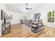 Spacious living room featuring wood flooring, neutral colors and ample natural light at 3100 Hickory Grove Dr, Monroe, NC 28110