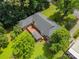 Aerial view of a home with an expansive backyard deck, gazebo, and mature trees at 324 Swamp Fox Dr, Fort Mill, SC 29715