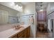 Bathroom featuring a vanity, mirror, tiled walls, and toilet at 324 Swamp Fox Dr, Fort Mill, SC 29715
