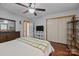 Bright bedroom featuring wood floors, a bed, closet, and dresser at 324 Swamp Fox Dr, Fort Mill, SC 29715